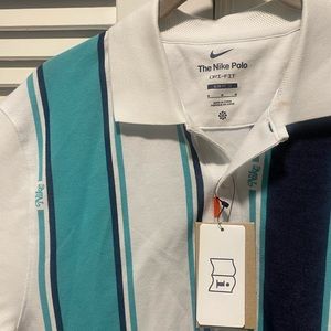 Nike striped polo with retro ”Nike” logo text